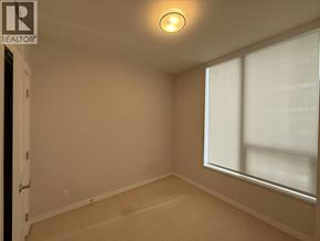 Vancouver apartment for rent - A room with a window and a carpeted floor.