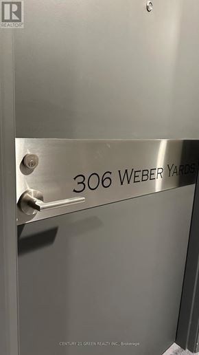 Kitchener condo for rent - A metal door with the number 306 Weber Yards on it.