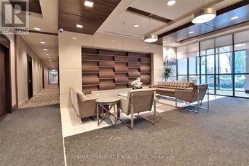 Mississauga (City Centre) condo for rent - A modern living room with a round table and chairs.