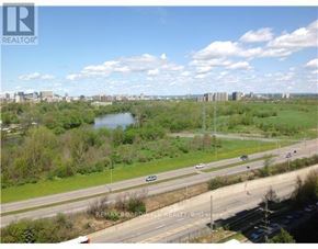 Ottawa house for rent - A highway with cars driving on it and a city skyline in the distance.