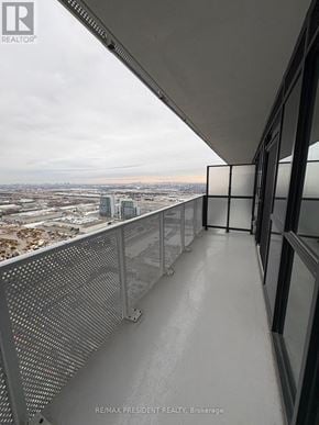 Vaughan (Vaughan Corporate Centre) condo for rent - A balcony with a metal railing overlooking a cityscape.