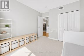 Ottawa condo for rent - A white room with a long bench and a door.