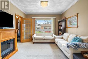 Guelph (Junction/Onward Willow) apartment for rent - A living room with a fireplace and a couch.