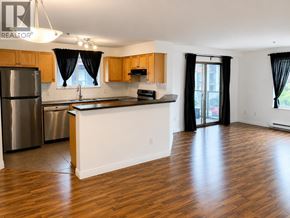 New Westminster apartment for rent - A kitchen with wooden floors and a white counter.