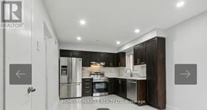 Ajax (Central West) apartment for rent - A brochure for a realtor company is on the wall of a kitchen.