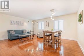 London North (North C) apartment for rent - A living room with a couch, chair, and table.