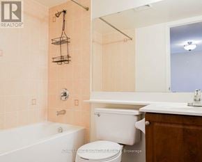 Richmond Hill (Langstaff) condo for rent - A bathroom with a tub, toilet, and sink.