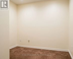 Richmond Hill (Langstaff) condo for rent - A room with a carpet floor and a white wall.