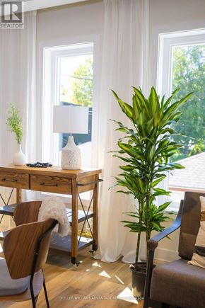 Toronto (Rockcliffe-Smythe) multi-family for rent - A room with a desk, chair, and a plant.