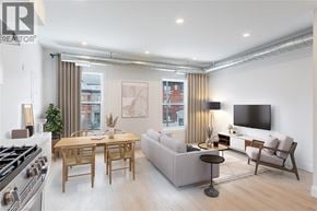 Hamilton apartment for rent - A modern living room with a dining table and a sofa.