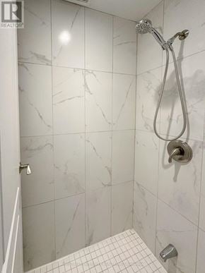 Toronto (Willowdale East) apartment for rent - A shower with a marble tile wall and a white tile floor.