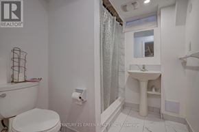 Brampton (Credit Valley) apartment for rent - A white bathroom with a toilet, sink, and shower.