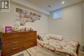 Brampton (Credit Valley) apartment for rent - A bedroom with a floral bedspread and a dresser with drawers.