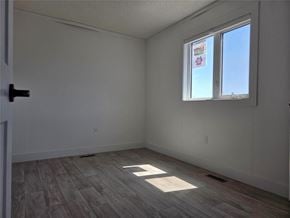 Mitchell apartment for rent - A room with a window and a door.