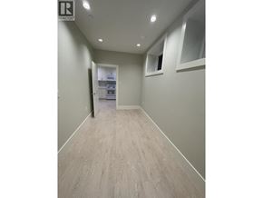 Vancouver apartment for rent - A long, empty hallway with a door at the end.