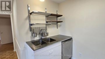 Toronto (Downsview-Roding-Cfb) apartment for rent - A stainless steel kitchen sink with a shelf above it.