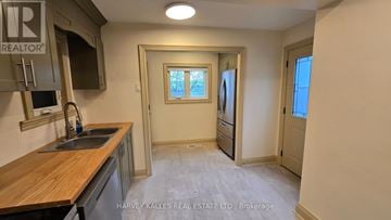 Toronto (Downsview-Roding-Cfb) apartment for rent - A kitchen with a sink and a window.