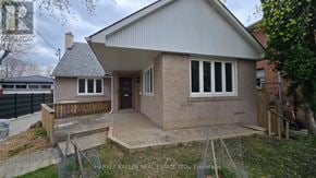 Toronto (Downsview-Roding-Cfb) apartment for rent - A small house with a brick exterior and a pitched roof.