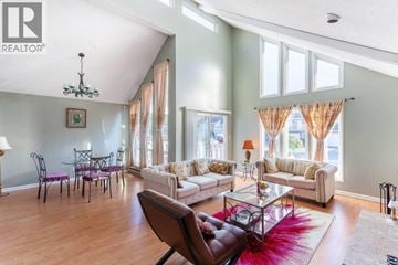 Richmond apartment for rent - A living room with a brown leather chair and a glass coffee table.
