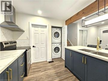 Cambridge apartment for rent - A modern kitchen with dark blue cabinets and a white countertop.