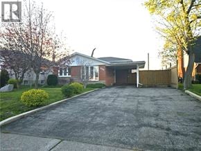 Cambridge apartment for rent - A house with a driveway and a garage.