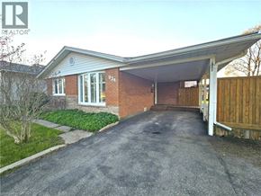 Cambridge apartment for rent - A house with a driveway and a garage.
