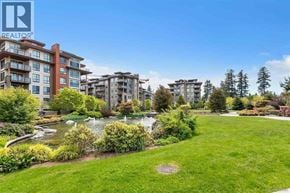 Vancouver apartment for rent - A realtor logo is on a picture of apartment buildings.