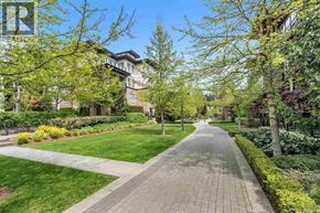 Vancouver apartment for rent - A tree-lined pathway in a park-like setting.