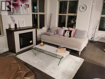 Vancouver apartment for rent - A living room with a white couch and a glass coffee table.