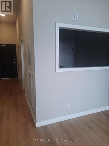 Peterborough (Town Ward 3) condo for rent - A room with a white door and a window with a white frame.