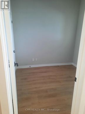Peterborough (Town Ward 3) condo for rent - A room with wooden flooring and white walls.