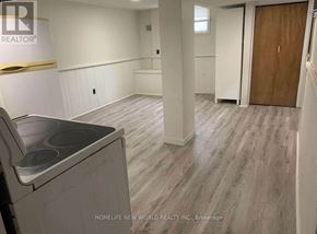 Toronto (Clairlea-Birchmount) apartment for rent - A room with a stove top oven and wooden flooring.