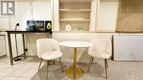 Markham (Aileen-Willowbrook) apartment for rent - A realtor's office with a table and chairs.