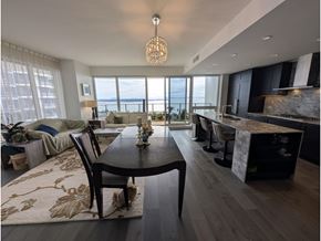 White Rock apartment for rent - A modern dining room with a view of the water.