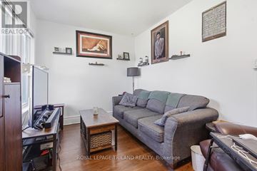 London East (East G) multi-family for rent - A living room with a grey couch and a coffee table.
