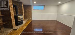 Toronto (Rustic) apartment for rent - A room with a fireplace and a window.