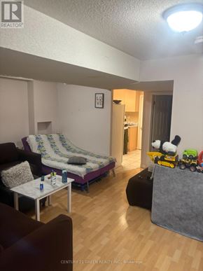 Mississauga (Meadowvale Village) apartment for rent - A living room with a couch, chair, and coffee table.