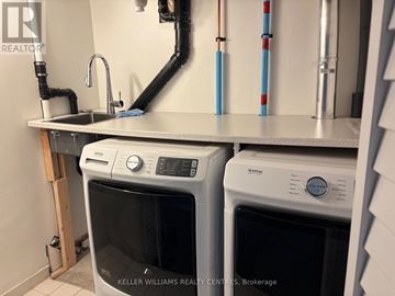 Richmond Hill (Westbrook) duplex for rent - A kitchen with a Keller Williams Realty logo.