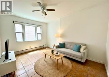 Hamilton apartment for rent - A living room with a couch, a coffee table, and a television.