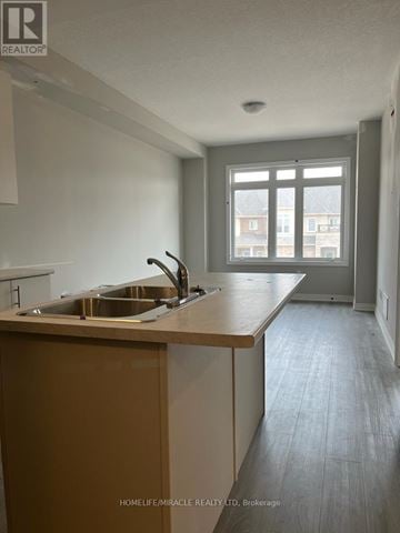 Hamilton (Winona) townhouse for rent - A kitchen with a sink and a window.