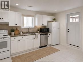 Windsor apartment for rent - A kitchen with white cabinets and appliances.