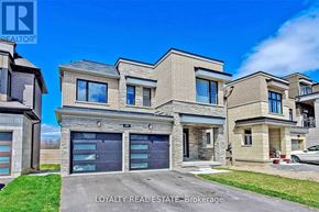 Clarington (Bowmanville) apartment for rent - A row of modern houses with garages are for sale.