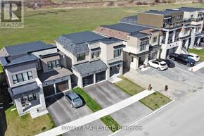 Clarington (Bowmanville) apartment for rent - A real estate company logo is displayed on an aerial image of a residential area.