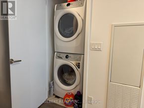 Vaughan (Beverley Glen) condo for rent - Two washing machines in a small laundry room.