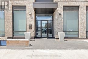 Hamilton (Beasley) condo for rent - The front of a building with a glass door and windows.