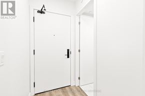 Hamilton (Beasley) condo for rent - A white door with a black handle and a black hinge.