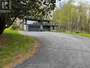 Caledon (Palgrave) apartment for rent - A modern house with a glass wall is for sale.