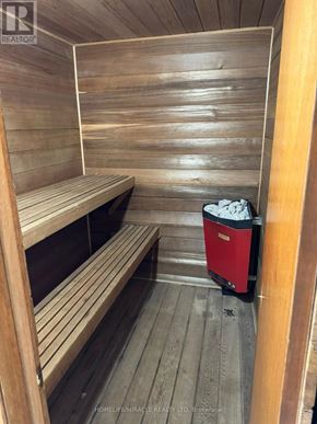Caledon (Palgrave) apartment for rent - A sauna room with wooden benches and a red cooler.