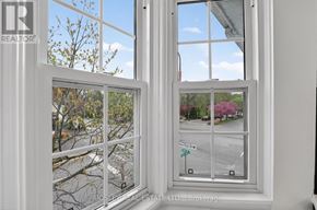 Niagara-On-The-Lake (Town) apartment for rent - A window with a view of a street and trees.