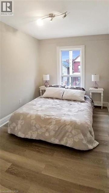 Hamilton apartment for rent - A bedroom with a large bed and a window.